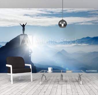 Picture of Bergsteiger auf einem Gipfel im Gebirge bei Nebel